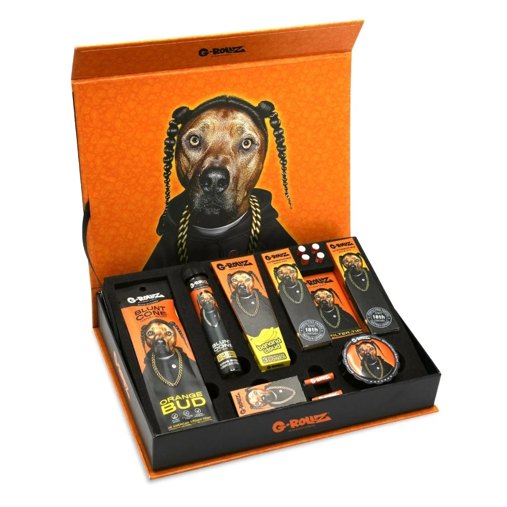 G-ROLLZ Gift Box Rap S, geöffnete orange Geschenkbox mit Rap-Hund-Motiv und arrangiertem Set-Inhalt aus Cones, Papers, Tips, Box und Grinder
